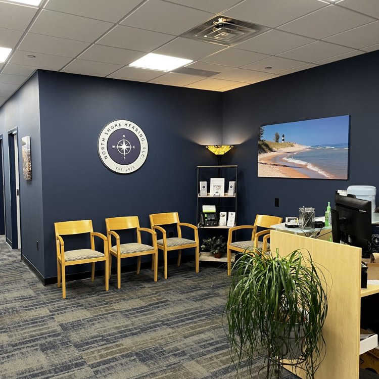 The welcoming North Shore Hearing waiting room, with the practice's compass logo on the wall