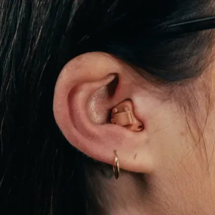 An in-the-canal hearing aid, a small custom shell that sits partway into the ear canal